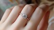 © Thavesak - Elegant Diamond Ring Adorning a Woman's Hand, Symbolizing Love and Commitment in Engagement Concept