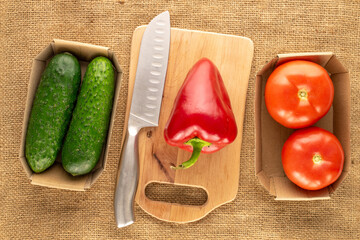 Wall Mural - Fresh ripe vegetables on jute cloth, macro, top view.