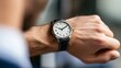 © Thavesak - Punctual Businessman Checking the Time on His Watch