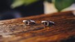 © Thavesak - Elegant Cufflinks Detail on Wooden Table for Formal Attire Accessories