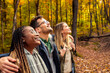 © Zoran Zeremski - Three friends having fun and enjoying hiking in forest lookig up.