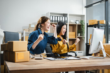 Wall Mural - young woman work in back office for checking the product in the warehouse, concept e commerce.