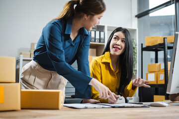 Wall Mural - young woman work in back office for checking the product in the warehouse, concept e commerce.