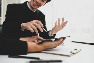 Cropped shot of young businesspeople collaborating on their new project at modern office