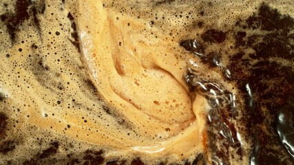 Wall Mural - Super Slow Motion of Mixing Coffee with Foam in Detail. Filmed on High Speed Cinema Camera, 1000fps. Top Down Composition. Speed Ramp Effect.