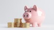 © Tackey - A cheerful pink piggy bank surrounded by shiny gold coins, symbolizing savings, finance, and financial planning.