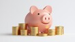 © Tackey - A cute pink piggy bank surrounded by shiny coins, symbolizing savings and financial growth in a minimalist setting.
