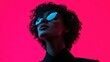 ©  lukaPixMedia - This image showcases an abstract artistic portrait silhouette with distinctive curly hair, set against a bold pink background, creating a striking visual effect.