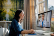 © Elathi - Woman having online medical consultation with doctor in bright room at home