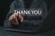 © Goodtime - businesswoman using a laptop and touching the message thank you on a display screen. concept of thank you business, congratulations, and appreciation gratitude. presentation from technology digital