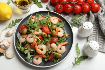 Delicious shrimp salad and ingredients on white table, flat lay