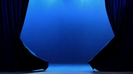 Aufkleber - The rich blue curtain creates a dramatic backdrop in a darkened venue, ready to unveil a captivating performance or presentation to the audience.