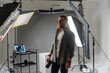 © Big Shot Theory - Professional photographer in modern studio with equipment setup and soft lighting