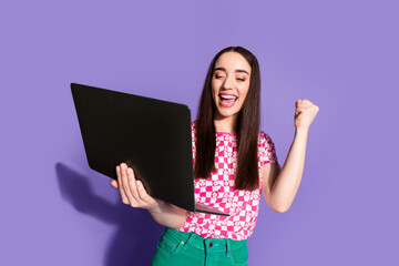 Canvas Print - Photo portrait of lovely young lady hold netbook winning dressed stylish pink garment isolated on violet color background