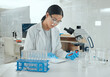 © peopleimages.com - Laboratory, woman and test tube with tablet for research, medicine information and notes for treatment. Clinic, female expert or scientist with sample for medical study, diagnosis or digital analysis