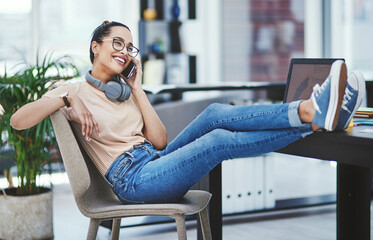 Poster - Phone call, relax and smile with designer woman in creative workplace for conversation or update. Business, desk and headphones with happy web development employee talking on mobile in office