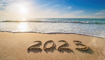 Wall Mural - 2025 year written on sandy beach sea at sunny day 