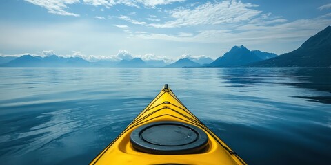 Poster - A yellow kayak on calm water with mountains in the distance.