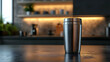 © Earny - A sleek stainless steel tumbler stands on a countertop, enhancing modern kitchen aesthetics with soft lighting in the background.