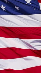 Wall Mural - close up of the us flag blowing in the breeze.
