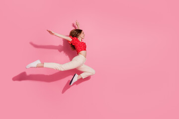 Canvas Print - Full length photo of lovely teen lady running flying graceful look empty space dressed stylish red garment isolated on pink background