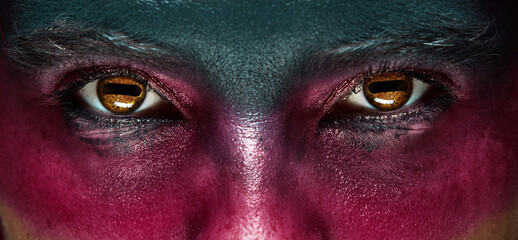 Closeup man eyes with holiday mascaraed makeup. Concept of Halloween, makeup. supernatural character. Flyer, banner.