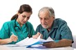 © Fotograf - A couple sitting at a table surrounded by papers, possibly discussing business or personal matters