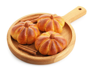 Tasty pumpkin shaped buns and cinnamon sticks isolated on white