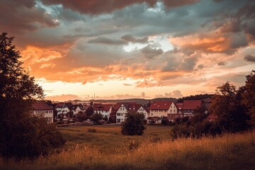 Wall Mural - Sky at golden hour in a town in Germany , ai