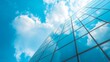 © Adi - A fragment of a modern office building in the capital .glass buildings with cloudy blue sky background .modern office building