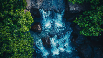 Wall Mural - aerial view of a waterfall in forest, waterfall in the jungle, tropical landscape in the jungl