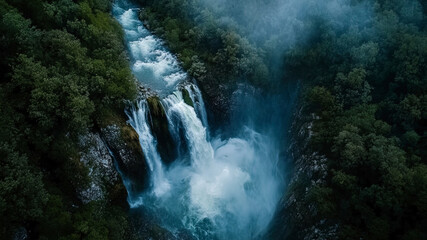 Wall Mural - aerial view of a waterfall in forest, waterfall in the jungle, tropical landscape in the jungl