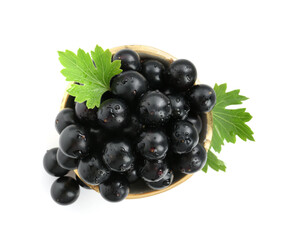 Wall Mural - Fresh ripe black currant berries with leaves isolated on white, top view