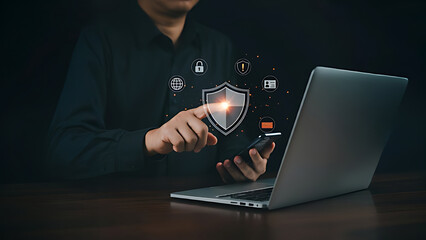 Protection network security and information security system concept. Information and cyber security technology services. Person use laptop and hand touching shield protect icon on virtual screen