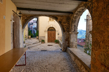 Canvas Print - A narrow street between the old houses of Picinisco in Lazio, Italy.