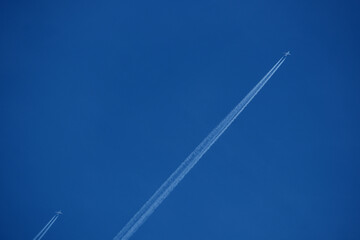 Wall Mural - contrails in the blue sky. Airplanes in the blue sky. 