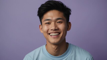 Wall Mural - teenage east asian man on pastel purple background model close-up smiling with beautiful teeth for ad concept space for text