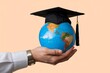 © Deivison - Hand holding a globe with graduation cap, concept of knowledge, learning and graduation.