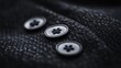©  lukaPixMedia - Artistic close-up shot of three black buttons aligned neatly on a textured fabric, representing attention to detail and the beauty of simplicity in design.