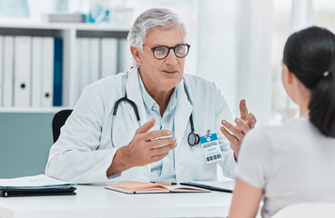 Canvas Print - Mature doctor, patient and consultation in clinic for healthcare, checkup results and advice. Medical professional, man and conversation for help, exam and explain treatment in hospital appointment