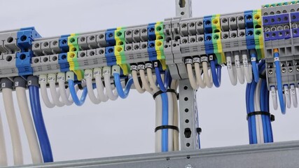 Sticker - Electrical screw through terminals with connected insulated copper wires with tips.