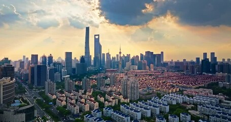 Wall Mural - Aerial shot of modern city skyline and commercial buildings at sunrise in Shanghai