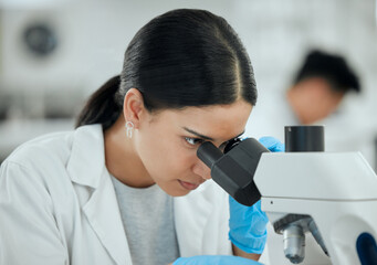 Poster - Woman, microscope and science in lab for healthcare, investigation or experiment results. Scientist, tech or study at table for medicine engineering, pharmaceutical development or research innovation