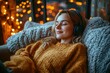 © Outkast - Young Woman Relaxing on a Sofa with Headphones and Cozy Blankets