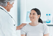 © peopleimages.com - Checkup, woman and doctor in hospital, healthcare and greeting of patient, smile and gynecologist. Office, talking and diagnosis in clinic, treatment and advice for contraception and obstetrician