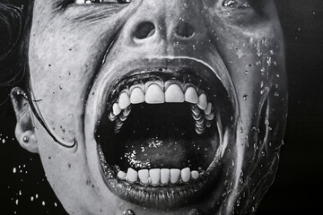 a black and white photo of a woman's mouth with water splashing on it