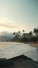 Wall Mural - Vertical footage of the ocean waves on a sandy beach at sunset, in Kihei, Maui, Hawaii, USA