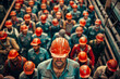 © Kostya - A group of construction workers wearing hard hats in a factory
