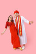 © Pixel-Shot - Beautiful Indian couple dancing on pink background