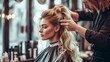 © Cantarela - GHairdresser doing wedding hairstyle for blonde woman in salon. Professional hairdressing services with hairstylist creating elegant hairstyle. Beauty and self-care concept